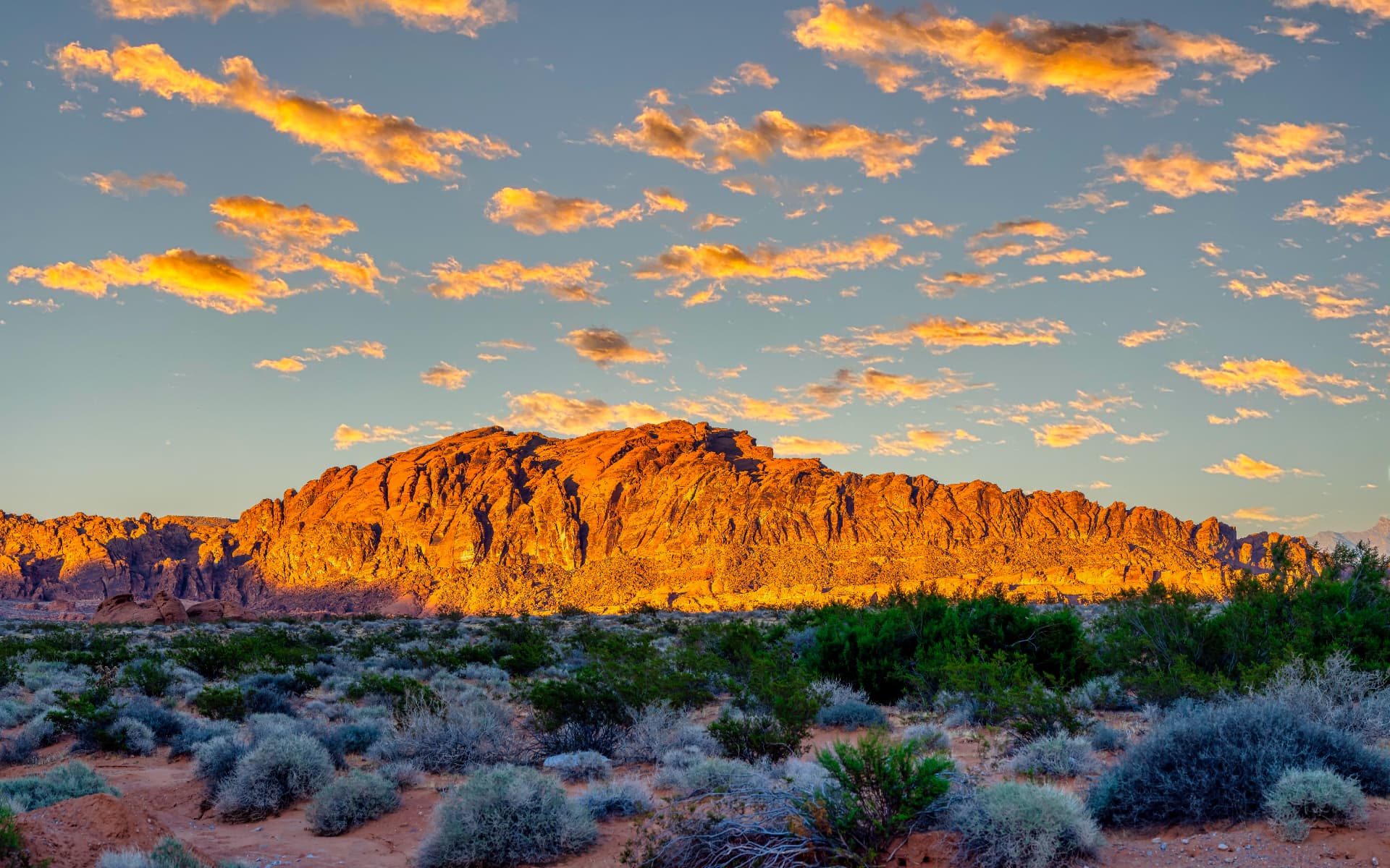 Sunlit Nevada mountains and desert landscape